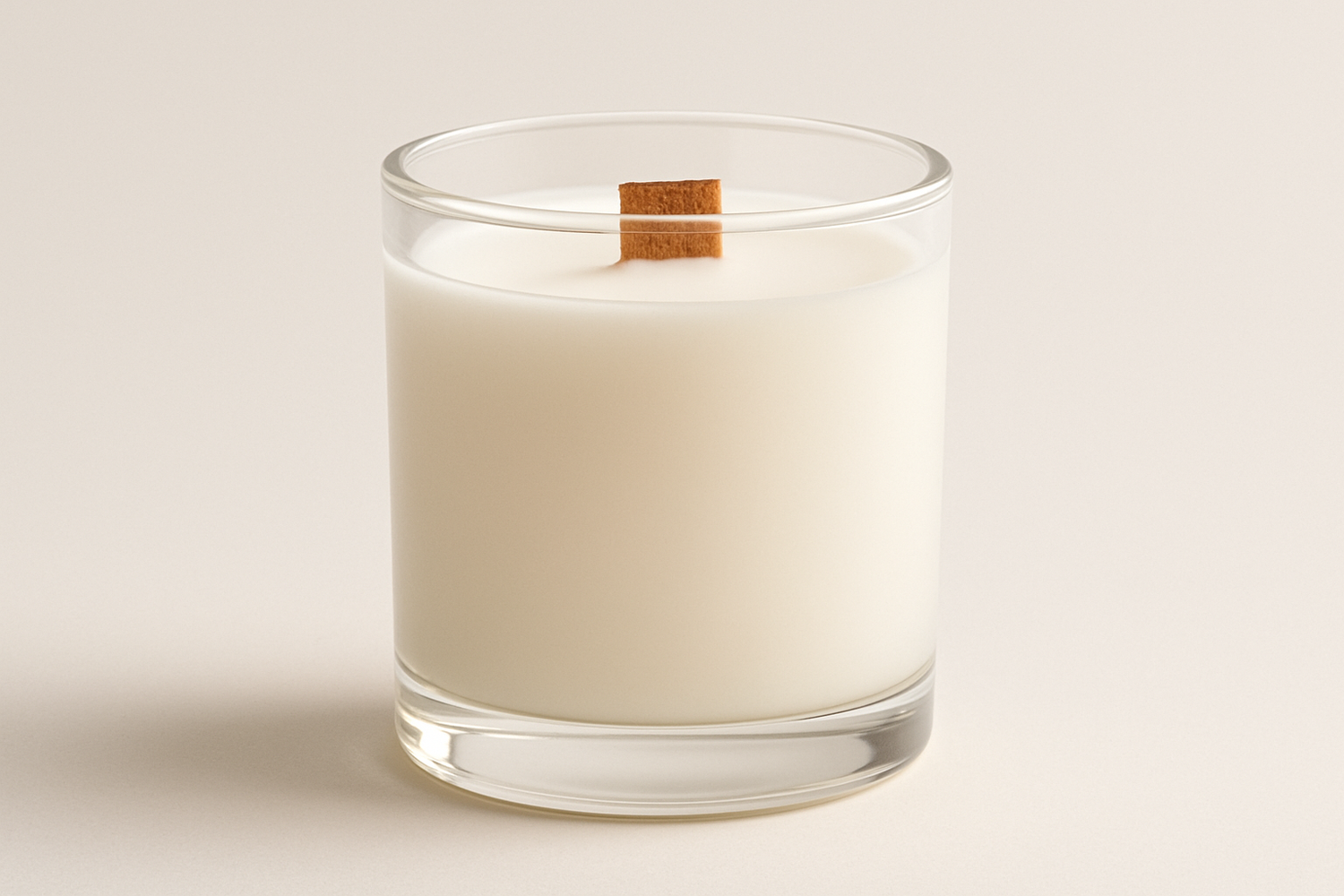 plain white candle in glass with wooden wick